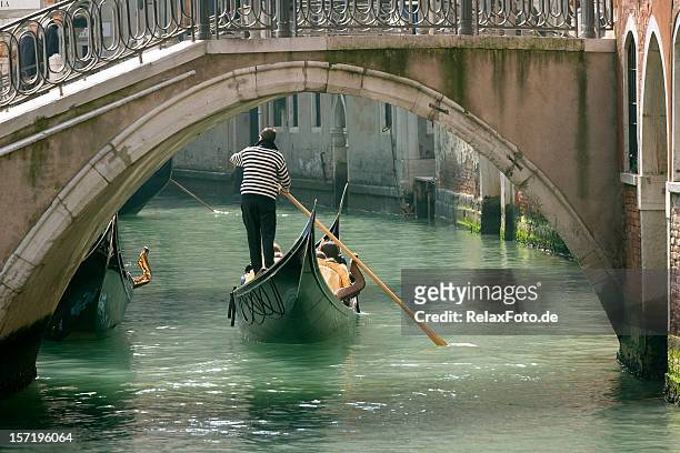 gondola in venice under old bridge (xxl) - gondolier stock pictures, royalty-free photos & images