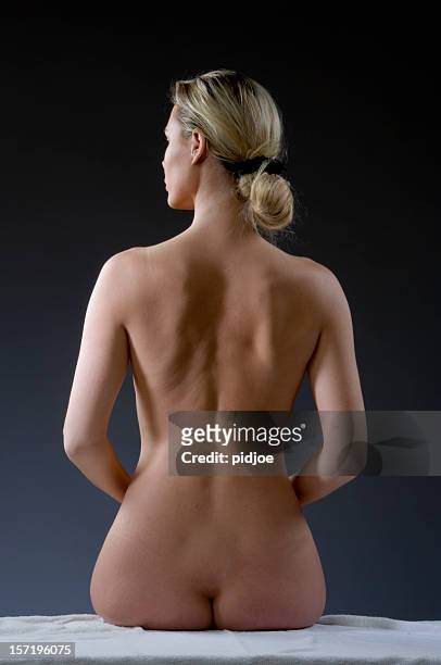 bare back of a blond woman - bare bottom women stockfoto's en -beelden