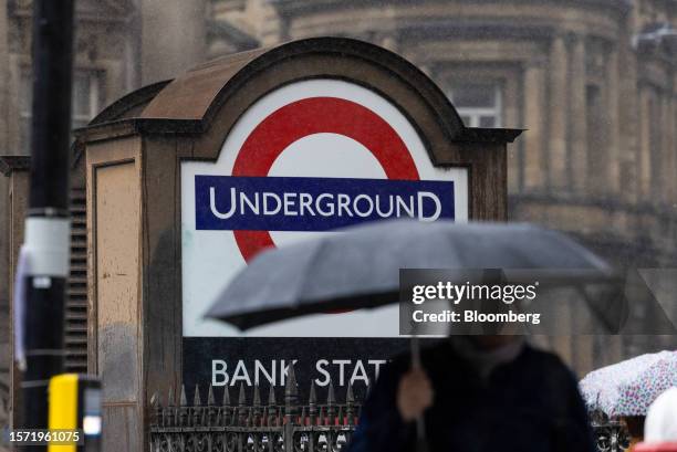 Commuters pass an entrance to the underground station next to the Bank of England in the City of London, UK, on Wednesday, Aug. 2, 2023. Speculation...