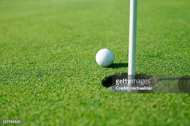 so close! - golf ball stock pictures, royalty-free photos & images