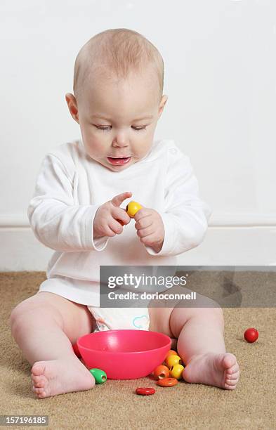 baby playing with beads - bead bildbanksfoton och bilder