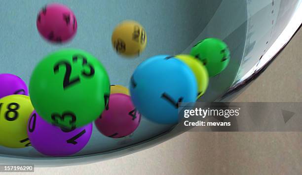 lottery numbers rolling around in container - game of chance stock pictures, royalty-free photos & images