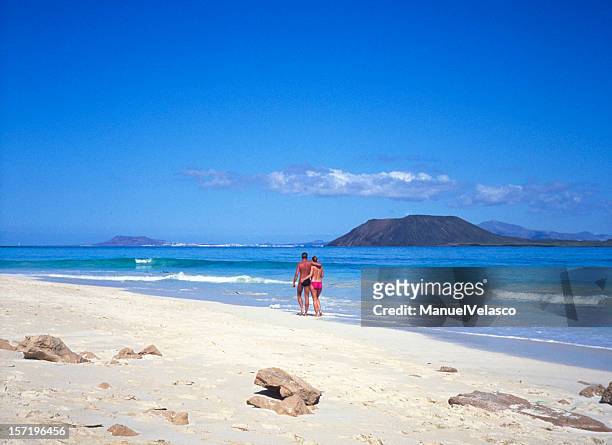 romantic walk on the sand - corralejo stock pictures, royalty-free photos & images