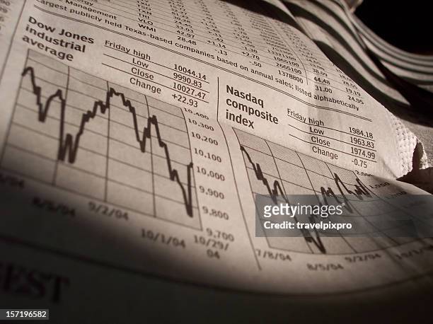 business news stock charts from newspaper - mutual fund stock pictures, royalty-free photos & images