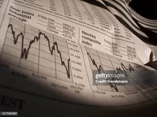 business news stock charts from newspaper - dow jones stock pictures, royalty-free photos & images