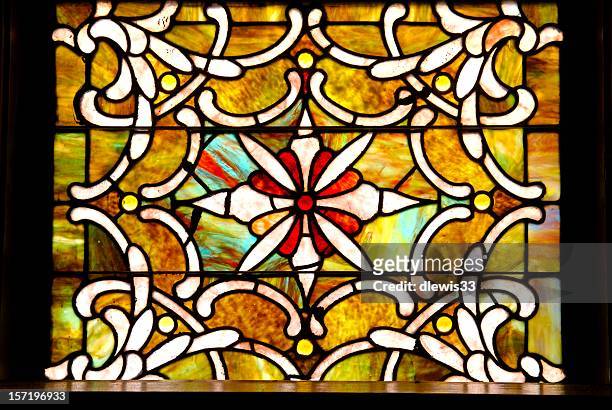antique stained glass window in sanctuary  - stained glass stockfoto's en -beelden