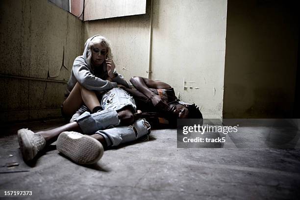 drug addicts finding solace in their vice - drug abuse stock pictures, royalty-free photos & images