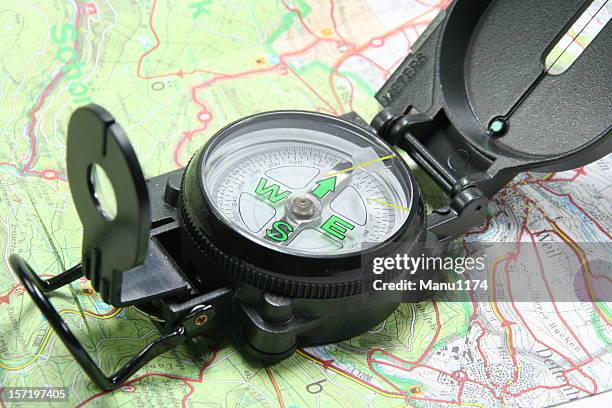 modern compass and map - modern compass stockfoto's en -beelden
