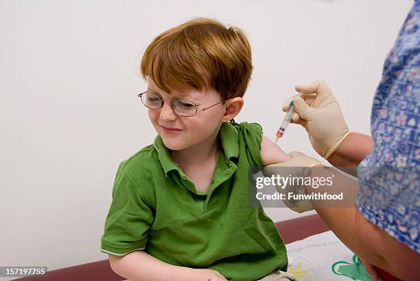 Child Receiving Injection 242 Nurse Pin Stock Photos, High-Res Pictures, and Images - Getty Images