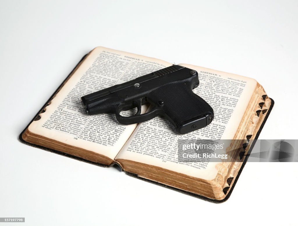 Pistol on Open Bible