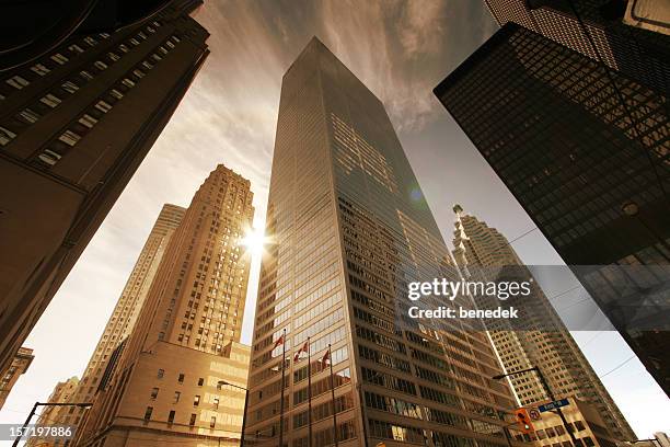 skyscrapers and sun - city skyscraper stock pictures, royalty-free photos & images