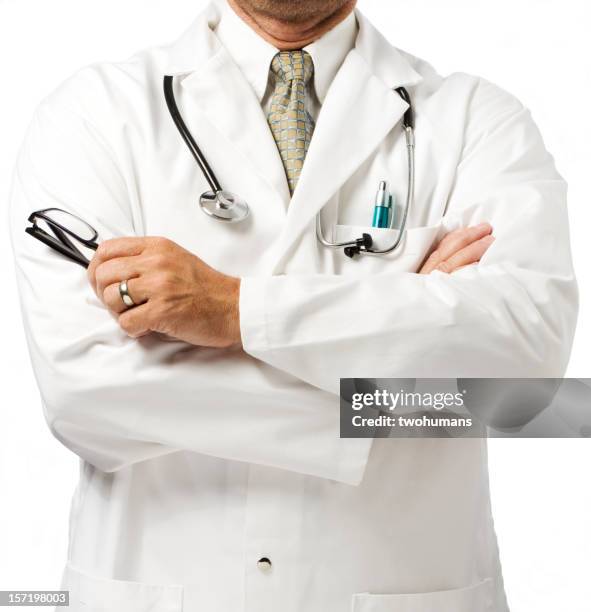 doctor in white coat with folded arms - lab coat pocket stock pictures, royalty-free photos & images