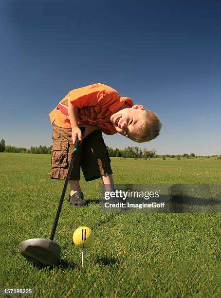 young caucasian male junior golfer - drivingrange stockfoto's en -beelden