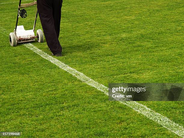 repairing line on football field - idrottsplatspersonal bildbanksfoton och bilder