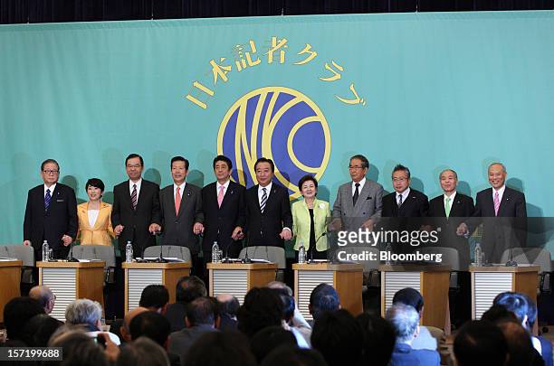 Party leaders pose for a group photograph before their debate ahead of the Dec. 16 general elections at the Japan National Press Club in Tokyo,...