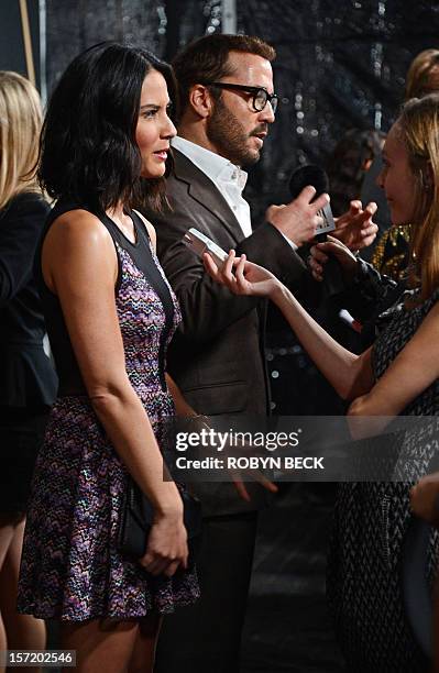 Actors Olivia Munn and Jeremy Piven answer questions from the media as they arrive for the Hollywood Foreign Press Association and InStyle...