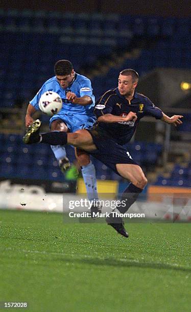 David Connolly of Wimbledon and Youssuf Safri in action during the Nationwide Division One match between Wimbledon and Coventry City at Selhurt Park...