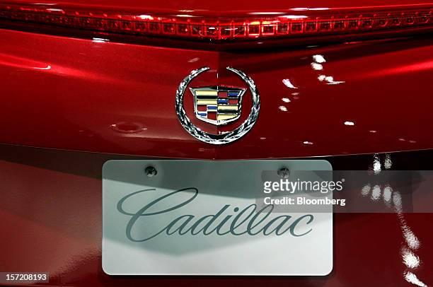 The General Motors Co. Cadillac logo is displayed on a vehicle during the LA Auto Show in Los Angeles, California, U.S., on Thursday, Nov. 29, 2012....