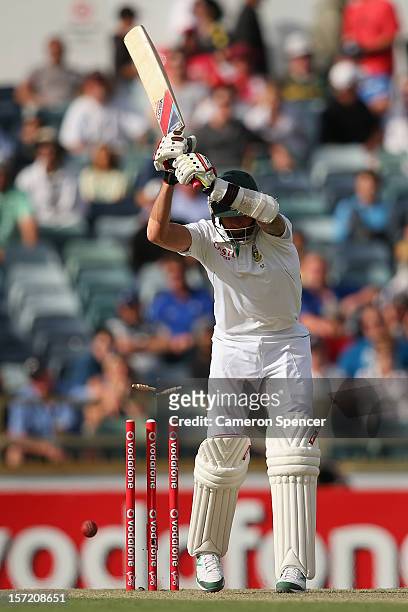 Dale Steyn of South Africa is bowled by Mitchell Johnson of Australia during day one of the Third Test Match between Australia and South Africa at...