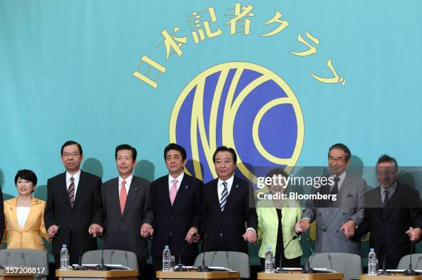 Party leaders pose for a group photograph before their debate ahead of the Dec. 16 general elections at the Japan National Press Club in Tokyo,...