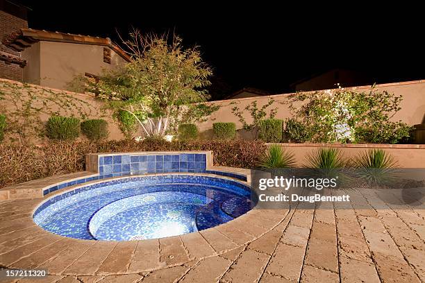 backyard spa at night - scottsdale arizona house stock pictures, royalty-free photos & images