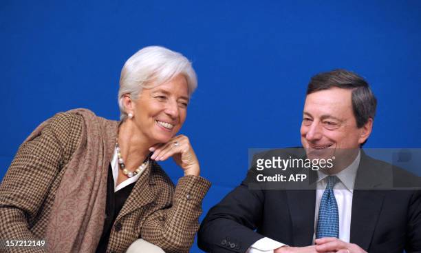 International Monetary Fund Managing Director Christine Lagarde talks with European Central Bank president Mario Draghi during the "Treasury Talks"...