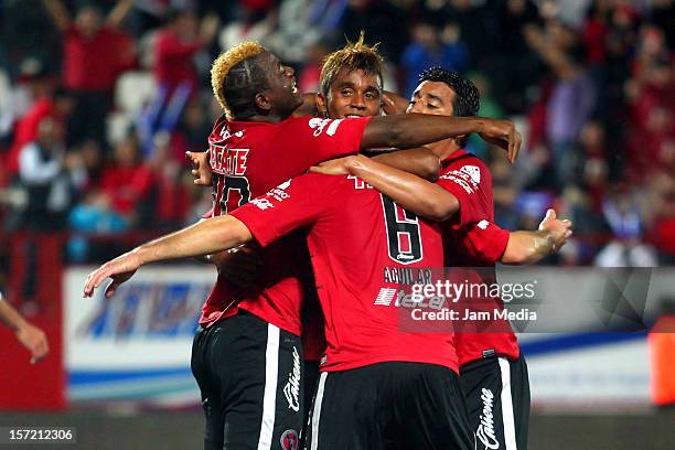 Duvier Riascos , Fidel Martinez and Pablo Aguilar of Tijuana celebrate a scored goal against Toluca during a final match between Tijuana and Toluca...