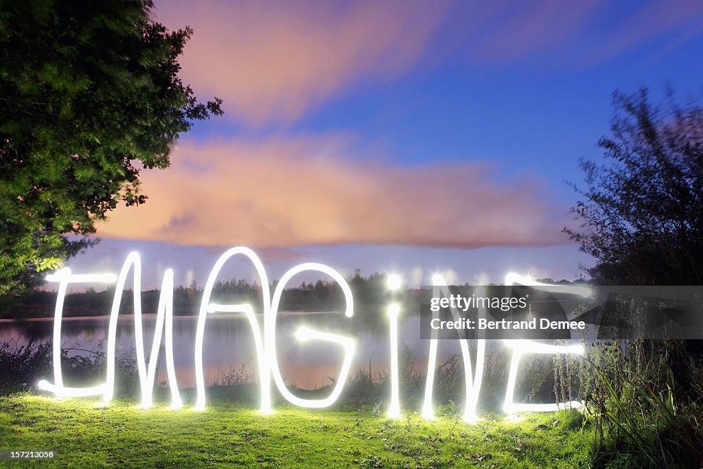 'Imagine' written in light