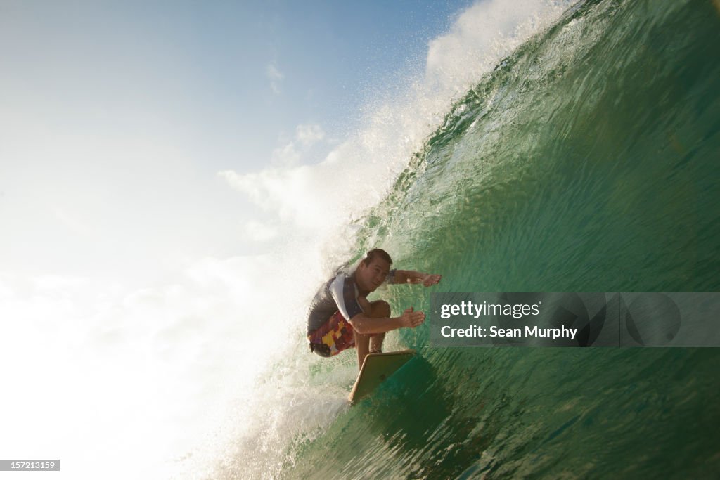 Man Surfing a barrel wave in Nicaragua