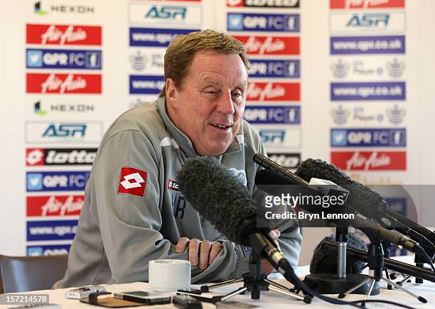 Manager Harry Redknapp talks to the media during a Queens Park Rangers press conference at Harlington Sports Centre on November 30, 2012 in...