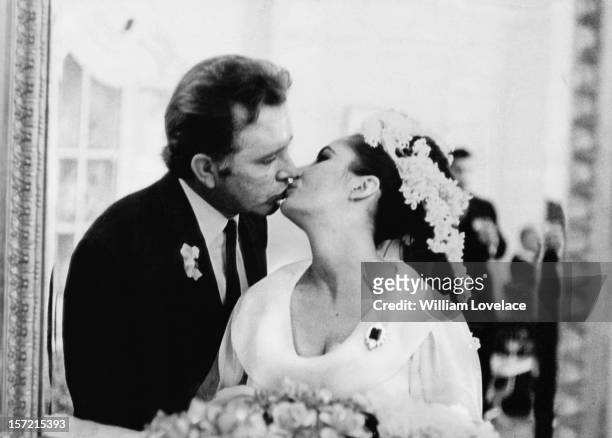 British film stars Elizabeth Taylor and Richard Burton at their first wedding in Montreal, Canada. They married twice, but both marriages ended in...