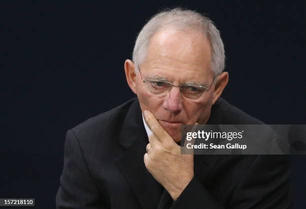 German Finance Minister Wolfgang Schaeuble waits to speak during debates over a financial aid package for stricken Greece at the Bundestag on...