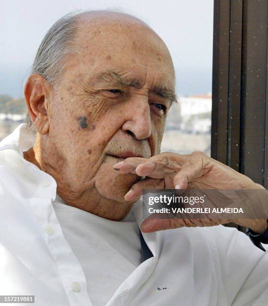 Brazilian architect Oscar Niemeyer poses for the photographer in his office above Copacabana beach in Rio de Janeiro 30 July 2003. Niemeyer received...