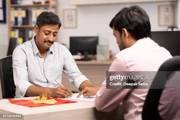 customer gold loan in bank stock photo - south indian ethnicity stock pictures, royalty-free photos & images