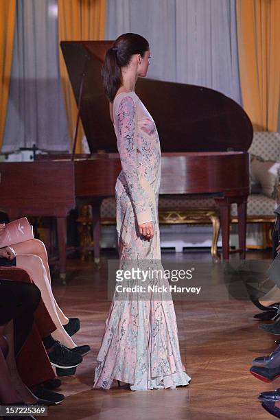 Models attends a catwalk show and auction hosted by Browns, Harpers Bazaar and H.E. Alain Giorgio Maria Economides in aid of Women for Women...