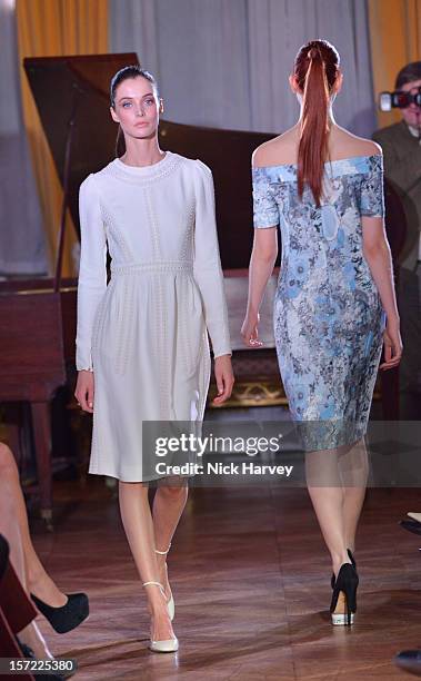 Models attends a catwalk show and auction hosted by Browns, Harpers Bazaar and H.E. Alain Giorgio Maria Economides in aid of Women for Women...