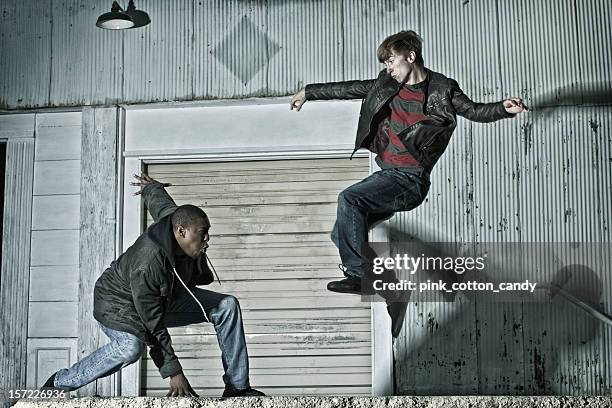 two young men practicing kenpo karate on the street - the way of the fight stock pictures, royalty-free photos & images