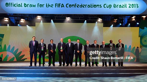 President, Joseph S.Blatter and FIFA Secretary General, Jerome Valcke pose for a photo with the coaches of the participating teams prior to the...