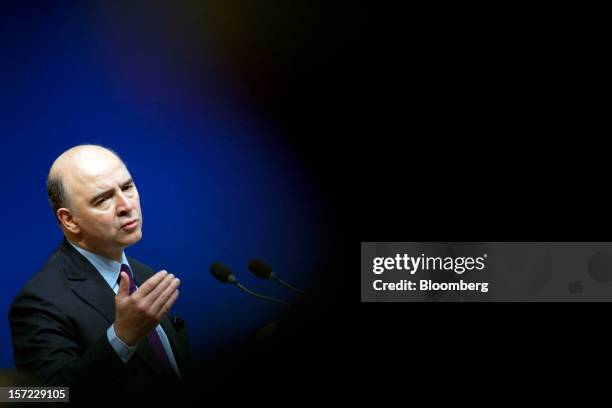 Pierre Moscovici, France's finance minister, gestures as he speaks during a financial conference at the Ministry of Economy, Finance and Industry in...