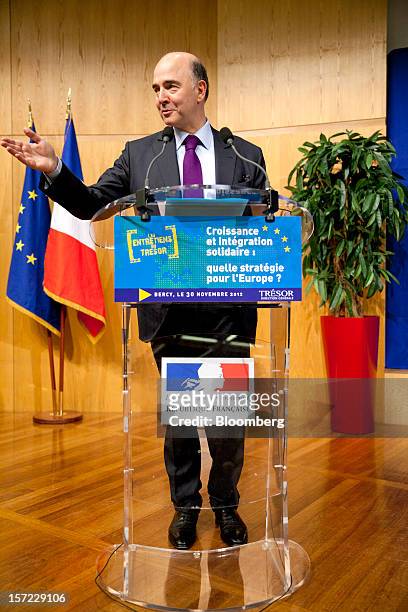 Pierre Moscovici, France's finance minister, gestures as he speaks during a financial conference at the Ministry of Economy, Finance and Industry in...
