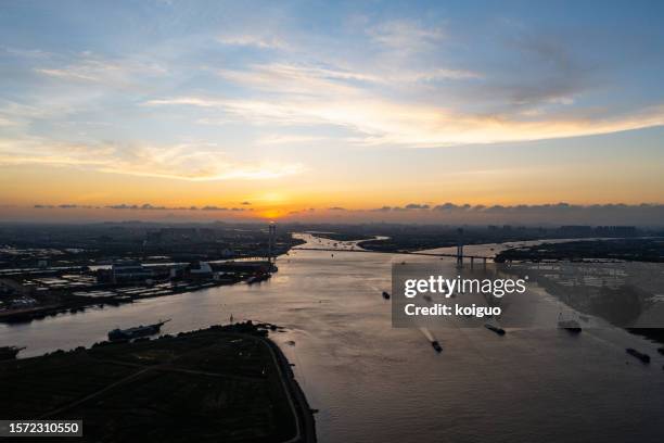 aerial view of riverside sunset - pearl river delta stock pictures, royalty-free photos & images