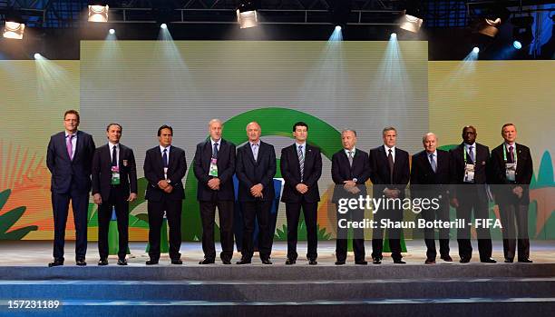 President, Joseph S.Blatter and FIFA Secretary General, Jerome Valcke pose for a photo with the coaches of the participating teams prior to the...