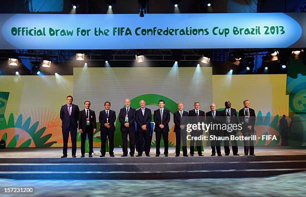 President, Joseph S.Blatter and FIFA Secretary General, Jerome Valcke pose for a photo with the coaches of the participating teams prior to the...