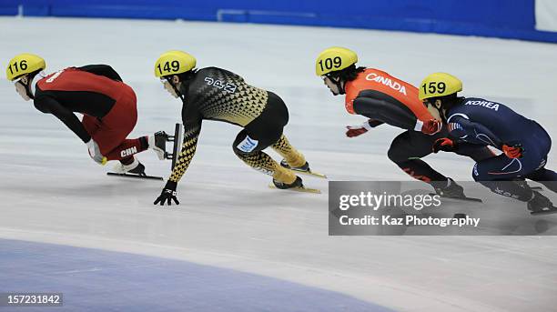 Daisuke Uemura of Japan chases Wenhao Liang of China in Race 3 of Men 500m Heats during day one of the ISU World Cup Short Track at Nippon Gaishi...