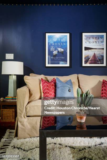 The Couch area with a black lacquer coffee table on fluffy white West Elm rug, in Justin Cronin's home office where he writes his best-selling books,...