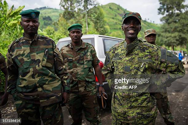 Rebel military leader Brigadier-General Sultani Makenga addresses officers whilst visiting withdrawing troops near the town of Sake in eastern...