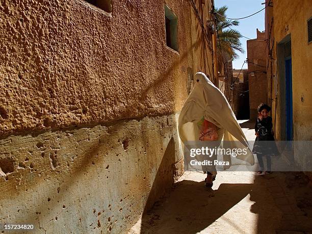 January 9th Village of Bounoura, Algeria. At the turn of an alley in the municipality of Bounoura, in the outskirts of Ghardaia, a woman carries the...