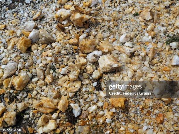 white and yellow quartz rocks in formazza valley - quartzite stock pictures, royalty-free photos & images