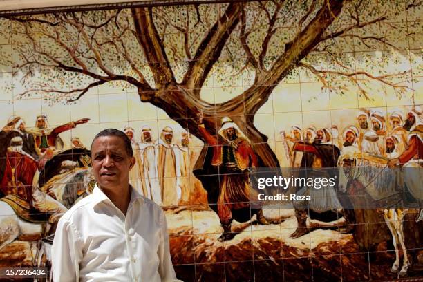 April 15th Algeria. On the road to the town of Mascara, Yasmina Khadra in front of a frescoe representing the allegiance to the Emir Abdelkader ,...