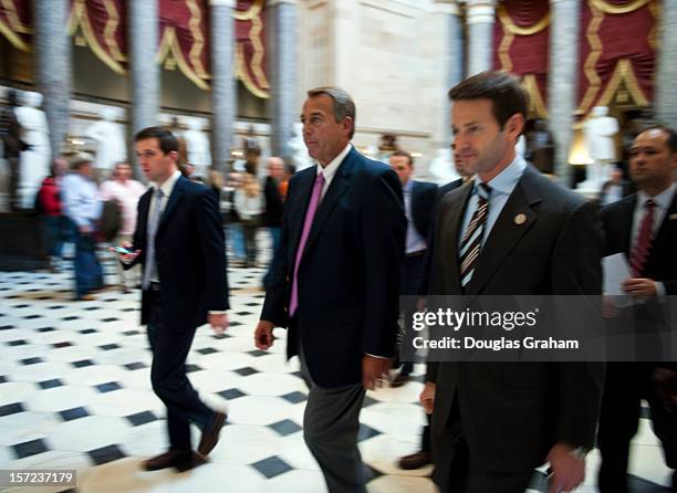 Nov 30: Speaker of the House John Boehner, R-OH and Rep. Aaron Schock, R-IL., make their way through Statuary Hall on the House side of the U.S....
